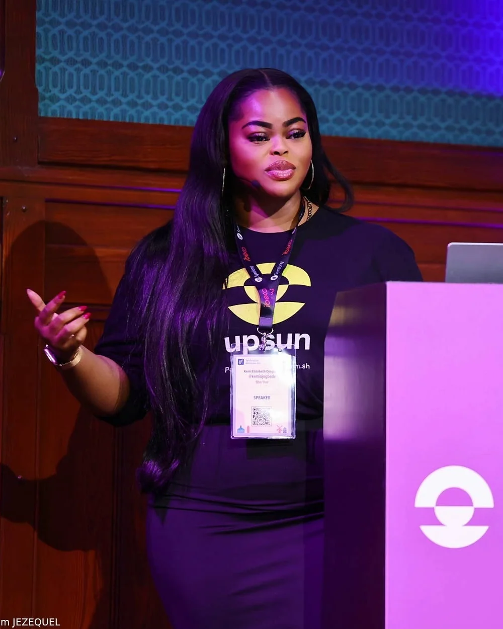 Kemi Elizabeth Ojogbede speaking on stage at SymfonyCon Amsterdam 2025
